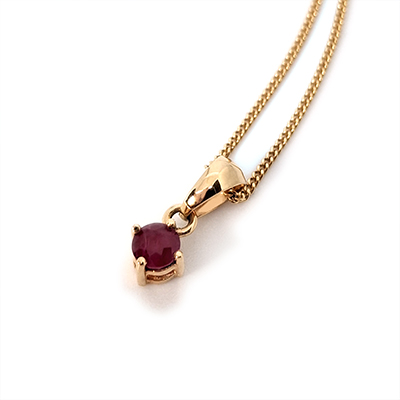 Dije de Oro 18k con Rubí